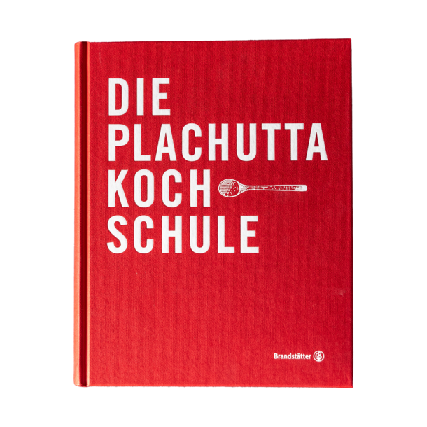 Wooden carport construction with tiled floor, garden and houses in the background.