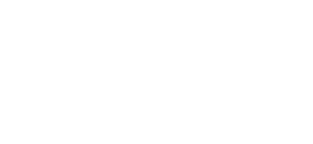 A modern, two-story building with wood paneling and a central, open garage under a cloudy sky.